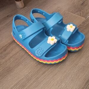 CROCS Blue Kids Sandals with White Daisy Accent and Rainbow Sole